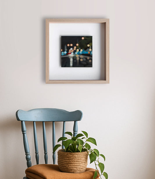 Blurry night time painting of Gore, New Zealand's main street. Bokeh lights. The Penny Drops. Wall art with blue orange.