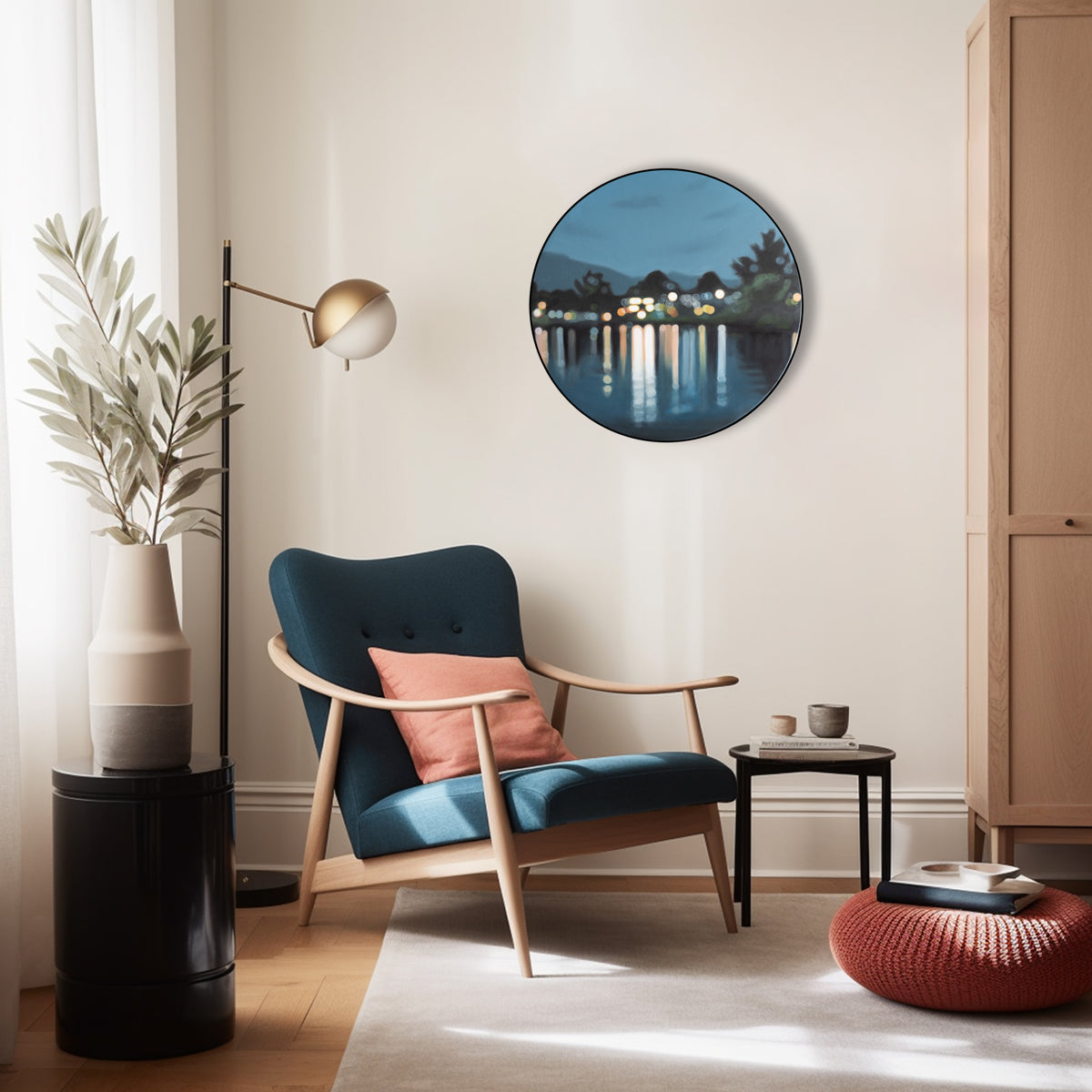 Blue painting of Lake Te Anau by New Zealand artist Mel McKenzie in a blurry bokeh style hanging on a wall in aliving room. Round oil painting on canvas framed in black shows lakeside lights reflected on water.