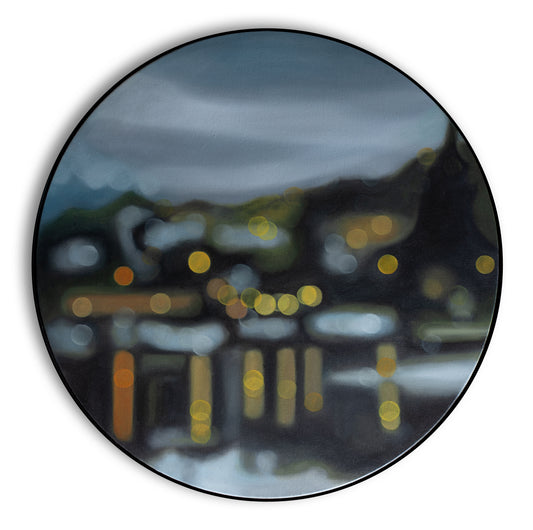 Wanaka, New Zealand, lakefront water reflections. Painting on round canvas framed in black circular frame. Painted in oils in a blurry bokeh style by New Zealand artist Mel McKenzie, The Penny Drops.