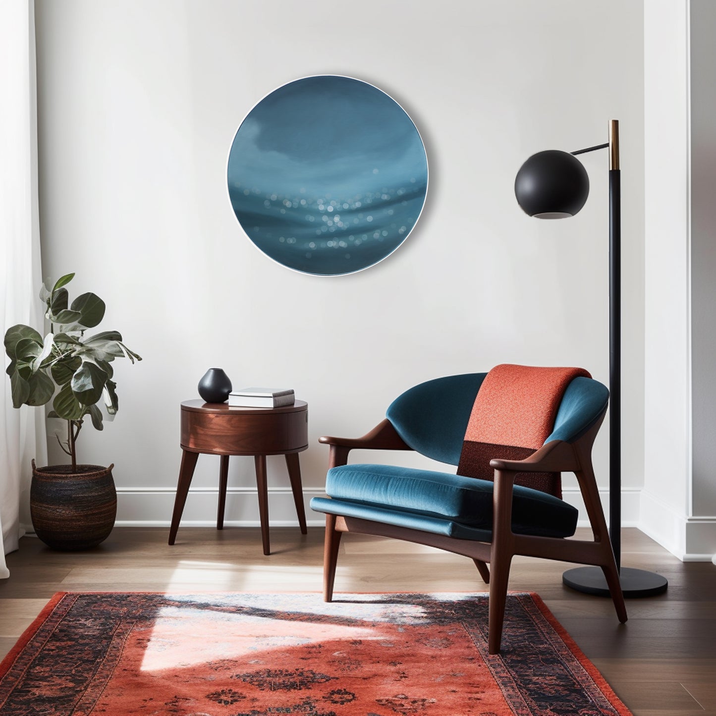 Art on round canvas framed in white on living room wall, water bokeh, shimmering light on ocean or lake. Blue painting by Mel McKenzie, The Penny Drops.