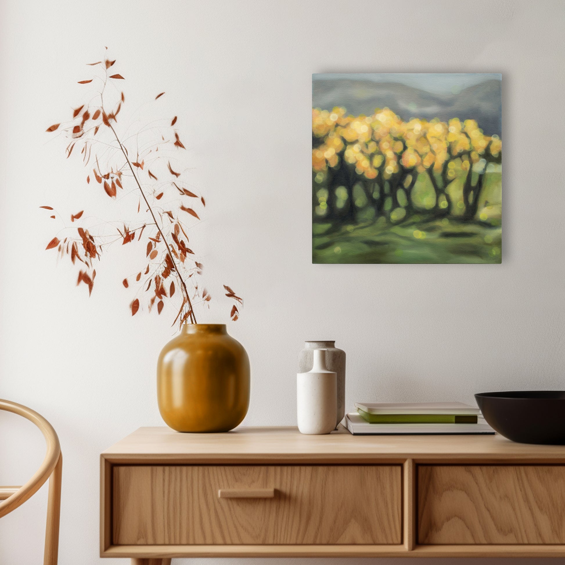 New Zealand vineyard painted in oils in a blurry bokeh style by NZ artist Mel McKenzie, The Penny Drops. Golden light in the autumn vines. Winery art from Central Otago hanging above console in dining room.