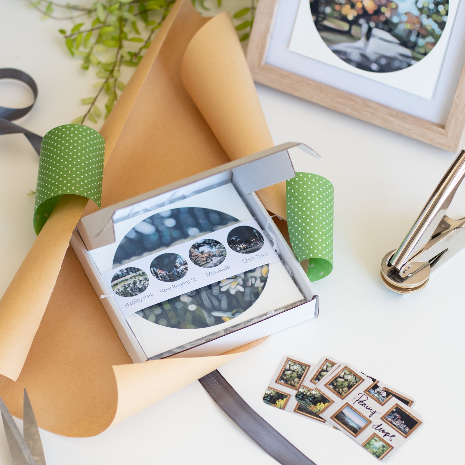 Packaged set of bokeh fine art prints with decorative elements on a table