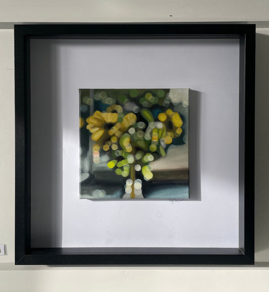Framed oil painting of sunflowers in a vase - painted in a blurry, bokeh style by New Zealand artist, Mel McKenzie